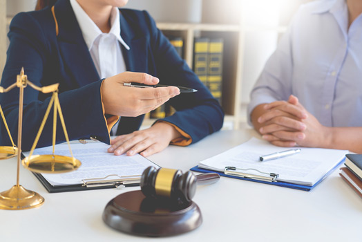 Person sitting with Lawyer talking